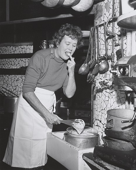 Julia laughing on set of The French Chef while preparing Lobster Thermidor in May 1966.