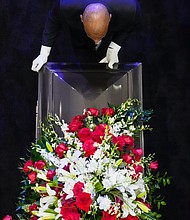 The casket of Rev. William “Bill” Lawson is taken from the sanctuary at Wheeler Avenue Baptist Church after his community celebration on Thursday, May 23, 2024, in Houston.
