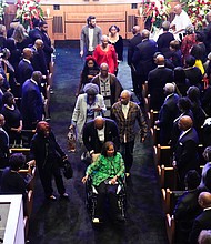 Melanie Lawson, daughter of Rev. William “Bill” Lawson, leaves with other family after a community celebration at Wheeler Avenue Baptist Church on Thursday, May 23, 2024, in Houston.