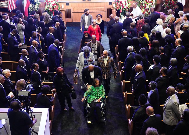 Melanie Lawson, daughter of Rev. William “Bill” Lawson, leaves with other family after a community celebration at Wheeler Avenue Baptist Church on Thursday, May 23, 2024, in Houston.