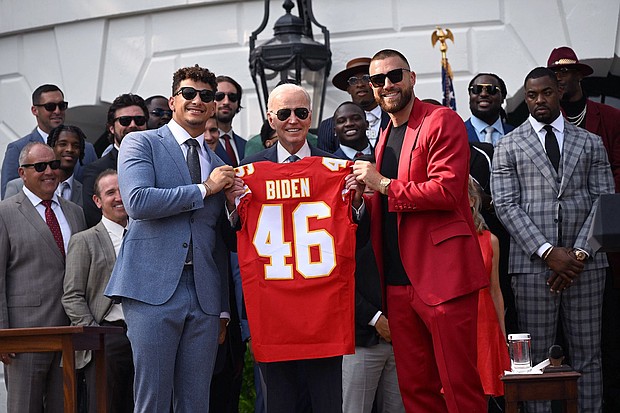Kansas City Chiefs tight end Travis Kelce and quarterback Patrick Mahomes present President Joe Biden with a jersey during a celebration for the Kansas City Chiefs last year.
Mandatory Credit:	Andrew Caballero-Reynolds/AFP/Getty Images via CNN Newsource