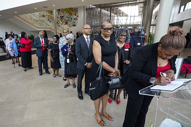 Mourners line up to sign the condolence book as they arrive for the celebration of life services for The Rev. William “Bill” Lawson at Wheeler Avenue Baptist Church on Friday, May 24, 2024 in Houston. Known for being a “Houston’s Pastor,” Lawson was the founding pastor of Wheeler Avenue Baptist Church who helped lead the Houston’s racial desegregation in the 1960s and continued to be a civil rights leader and spiritual guide throughout his life. He retired from the pulpit in 2004, but remained active in the church until his death on May 14 at age 95.