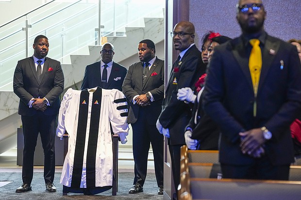 The Rev. William “Bill” Lawson’s robes are carried into the sanctuary of the Wheeler Avenue Baptist Church during the celebration of life for the church’s founder on Friday, May 24, 2024 in Houston. Known for being a “Houston’s Pastor,” Lawson was the founding pastor of Wheeler Avenue Baptist Church who helped lead the Houston’s racial desegregation in the 1960s and continued to be a civil rights leader and spiritual guide throughout his life. He retired from the pulpit in 2004, but remained active in the church until his death on May 14 at age 95.