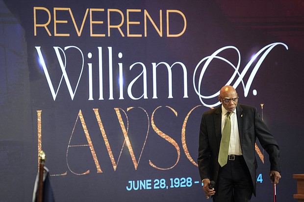 Dr. James Douglas walks onto the pulpit to speak during the celebration of life services for The Rev. William “Bill” Lawson on Friday, May 24, 2024 in Houston. Known for being a “Houston’s Pastor,” Lawson was the founding pastor of Wheeler Avenue Baptist Church who helped lead the Houston’s racial desegregation in the 1960s and continued to be a civil rights leader and spiritual guide throughout his life. He retired from the pulpit in 2004, but remained active in the church until his death on May 14 at age 95.