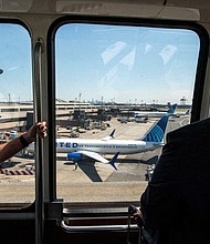 ravelers arrive to the Newark Liberty International Airport during the Memorial Day weekend in Newark, New Jersey, May 24.
Mandatory Credit:	Eduardo Munoz/Reuters via CNN Newsource