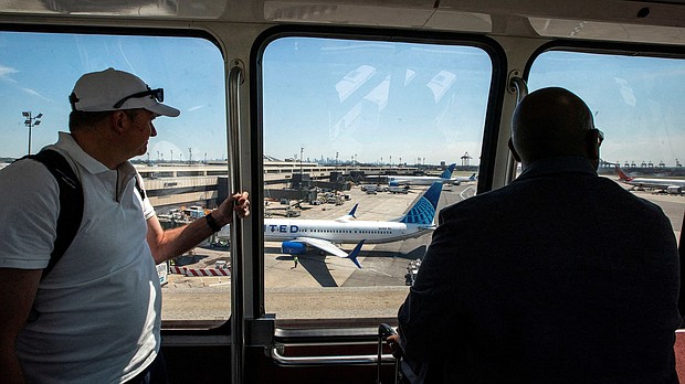 ravelers arrive to the Newark Liberty International Airport during the Memorial Day weekend in Newark, New Jersey, May 24.
Mandatory Credit:	Eduardo Munoz/Reuters via CNN Newsource