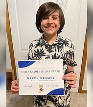 Daken Kramer is the first recipient of the Daken Kramer Legacy Award. Daken paid off the entire meal debt and then some, for his elementary school in Blue Springs, Missouri.
Mandatory Credit:	Courtesy Vanessa Kramer via CNN Newsource