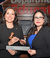 Outgoing Board President Andrea Duhon passes the gavel to Precinct 2 Trustee Amy Flores Hinojosa, HCDE’s new Board President.
