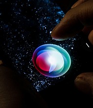 Siri is displayed on a smartphone.
Mandatory Credit:	Thomas Trutschel/Photothek/Getty Images/File via CNN Newsource