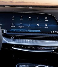 Close-up of the 2025 Cadillac OPTIQ’s 33-inch-diagonal interface and display with 9K resolution.