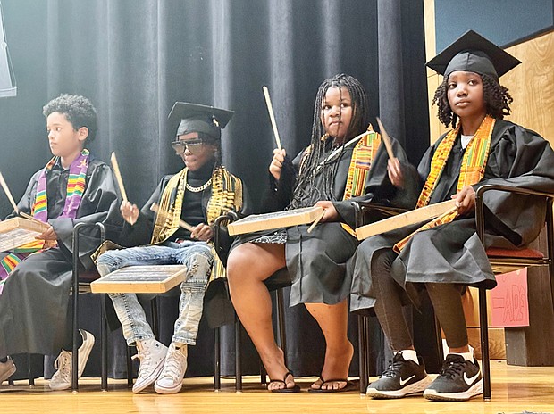 The Cultural Roots Homeschool Cooperative’s “Moving On” ceremony opened with an African drum procession Wednesday, May 29, at Pine Camp Cultural Arts and Com­ munity Center on Old Brook Road. The Cultural Roots Homeschool Cooperative, founded by Alycia Wright, has about 125 students that participate in the education­ al classes and experiences that the families work togeth­er to select and fund each year.