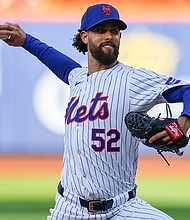 Jorge López throws a pitch during the 10th inning of the New York Mets' game against the Los Angeles Dodgers on May 28. López threw his glove into the crowd following his ejection from a game against the Los Angeles Dodgers on Wednesday.
Mandatory Credit:	Gordon Donovan/NURPHO/AP via CNN Newsource