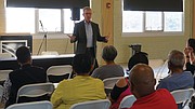 Virginia Union University Spokesperson Grant Neely addresses attendees of the Edgehill Chamberlayne Court Civic Association meeting on Tuesday.