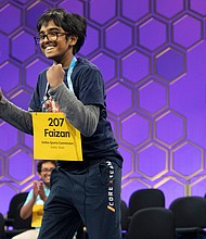 Faizan Zaki, 12, of Allen, Texas, reacts after spelling his final word correctly during the semifinals of the Scripps National Spelling Bee on Wednesday.
Mandatory Credit:	Jacquelyn Martin/AP via CNN Newsource