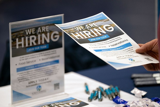 A job hunter takes a flyer at a job fair at Brunswick Community College in Bolivia, North Carolina, on April 11. The number of job openings in the US shrank for the second month in a row.
Mandatory Credit:	Allison Joyce/Bloomberg/Getty Images via CNN Newsource