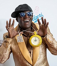 Rapper Flavor Flav is getting behind the US women's water polo team at the Paris Olympics.
Mandatory Credit:	Amanda Edwards/Getty Images via CNN Newsource