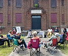 Community members return to the former Richmond Community Hospital for another “Community Church on the Lawn” meeting. The purpose of the meetings is to advocate for the preservation of the historic structure.