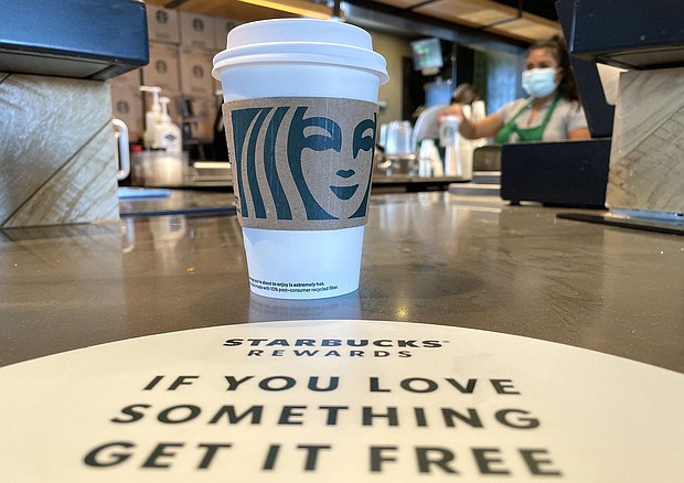 The Starbucks logo is displayed on a cup at a Starbucks store in October 2021 in Marin City, California. Starbucks is teaming up with Grubhub as it tries to boost sales after a challenging quarter.
Mandatory Credit:	Justin Sullivan/Getty Images via CNN Newsource