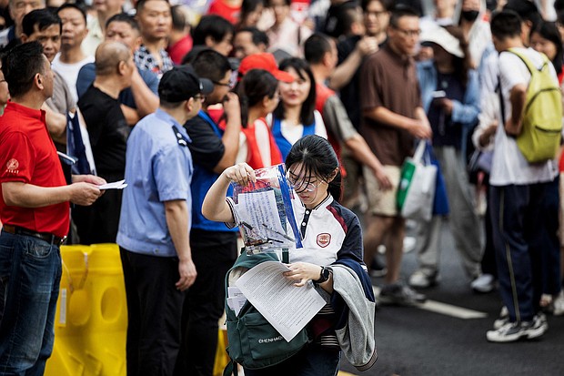 A student enters a school on the first day of the national college entrance examination, known as "gaokao", in Wuhan, China on June 7.
Mandatory Credit:	AFP/Getty Images via CNN Newsource