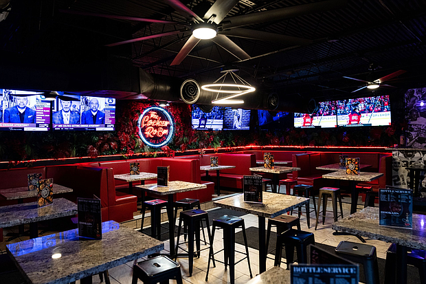Wrapped in 20 big screens, The Locker Room Sports Bar & Grill offers the best seat in the house for major sporting events.
Photo: Visual Influence