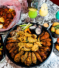 The Locker Room Sports Bar & Grill’s delicious 20pc and 50pc Wing Platters come in over 12 flavors and will be specially priced for boxing fans for the Fight Night Watch Party on June 15.
Photo: Visual Influence