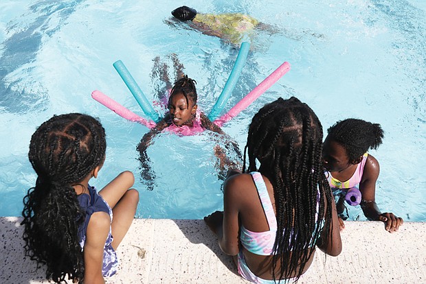 Eight-year-old Ziya Harris,  a rising third grader at Fox Elementary School is excited that school is out and that she can relax in the pool with her colorful noodles that keep her afloat at the Woodville Pool at 305 Fairfield Ave. Saturday, June 2,  along with her friends seven -year-old Royalty MacNeir, seated left,  eight-year-old Jailynn Bogle, center,  and nine-year-old London Brown, all of Richmond..Richmond Parks and Recreation's city public pools are open. Their hours are noon -8 p.m everyday. The following is a list of all of the Richmond pools that are free to all people:..Randolph Public Swimming Pool, 1507 Grayland Ave..Battery Park Pool, 2719 Dupont Circle.Powhatan Pool, Powhatan Community Center at 5051 Northampton St..Swansboro Pool, 3160 Midlothian Turnpike.Fairmount Pool, 2000 U St..Blackwell Pool, E. 16th St. & Everett St..Bellemeade Pool, 1800 Lynhaven Ave..Woodville Pool, 2305 Fairfield Ave..Hotchkiss Field Pool, 701 E. Brookland Park Blvd