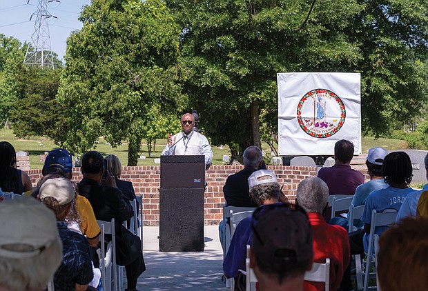 Benjamin Ross addresses an audience before the unveiling of the woodland Historic Marker.  Richmond and  area residents celebrate the 107th Birthday of Woodland Cemetery with the unveiling of a Historic Marker and Woodland Fountain as well as refreshments in the cemetery Chapel.  Sandra Sellars/Richmond Free Press.