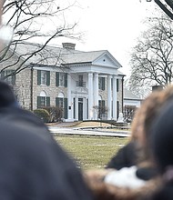 Fans gather outside Graceland to pay their respects at the memorial for Lisa Marie Presley in January 2023 in Memphis, Tennessee. Last month, Elvis Presley's iconic Memphis home was nearly auctioned off by a seemingly fraudulent company.
Mandatory Credit:	Justin Ford/Getty Images via CNN Newsource