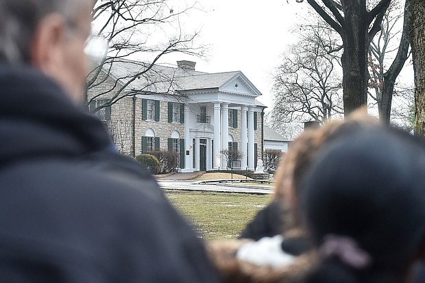 Fans gather outside Graceland to pay their respects at the memorial for Lisa Marie Presley in January 2023 in Memphis, Tennessee. Last month, Elvis Presley's iconic Memphis home was nearly auctioned off by a seemingly fraudulent company.
Mandatory Credit:	Justin Ford/Getty Images via CNN Newsource