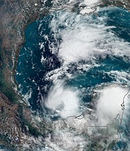Satellite imagery shows areas of thunderstorms in the Gulf of Mexico Monday afternoon as the first tropical system of the year brews.
Mandatory Credit:	CNN Weather via CNN Newsource