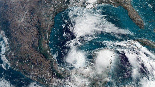 Satellite imagery shows areas of thunderstorms in the Gulf of Mexico Monday afternoon as the first tropical system of the year brews.
Mandatory Credit:	CNN Weather via CNN Newsource