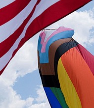 The U.S. and Rainbow flag blows in Franklin, Tennessee, in June 2023. A federal judge ruled on June 17 that the Biden administration cannot enforce new protections for LGBTQ+ students in Ohio, Virginia and four other states.
Mandatory Credit:	Kevin Wurm/Reuters via CNN Newsource