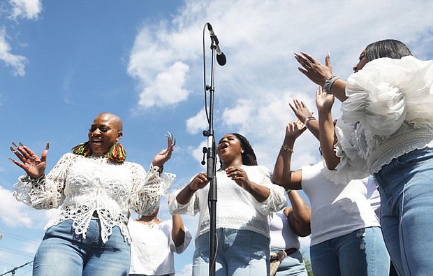 Malisha ‘Cat’ Todd, left, sings with fellow members of Tim Mallory and Leviticus during Virginia Union University’s Hezekiah Walker Center for Gospel Music’s Juneteenth celebration on Saturday, June 15.