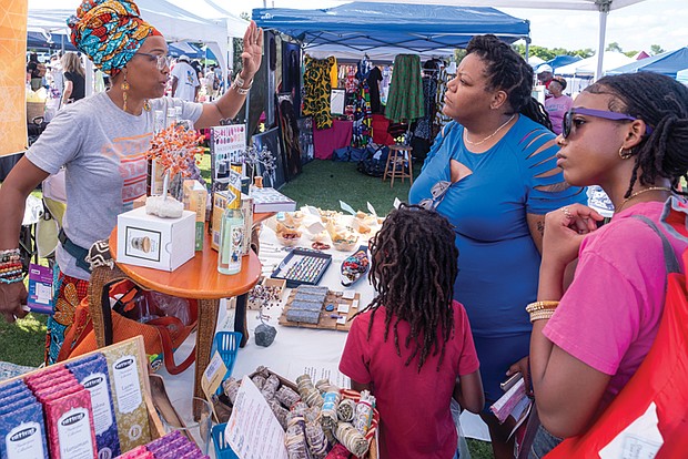 Seshat Kara of Seven Stones Crystals with Jorden Larry, Kristisnna Phillips and Austin Larry during Henrico County’s annual Juneteenth celebration June 15 in Dorey Park.