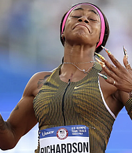 Sha'Carri Richardson reacts after winning the women's 100 meter dash final on Day 2 of the 2024 US Olympic Team Track & Field Trials at Hayward Field in Eugene, Oregon, on June 22.
Mandatory Credit:	Patrick Smith/Getty Images via CNN Newsource