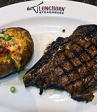 Steak and a loaded potato at LongHorn Steakhouse.
Mandatory Credit:	Lori Van Buren/Albany Times Union/Getty Images via CNN Newsource