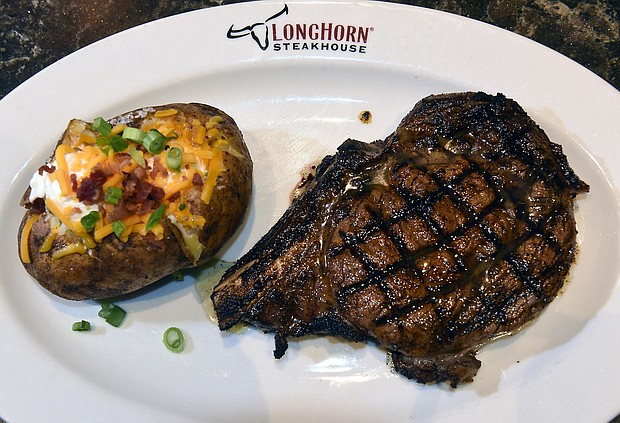 Steak and a loaded potato at LongHorn Steakhouse.
Mandatory Credit:	Lori Van Buren/Albany Times Union/Getty Images via CNN Newsource