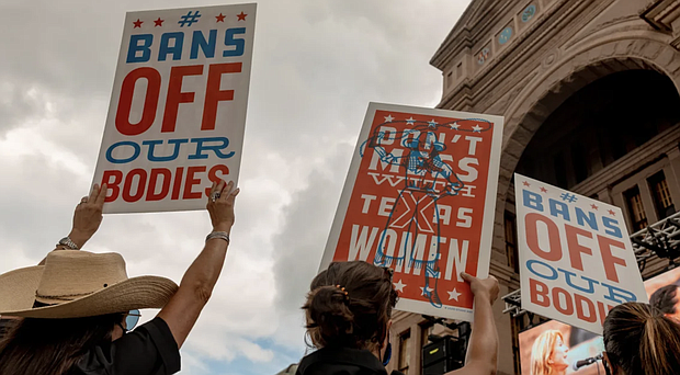 Demonstrators hold signs outside the Texas State Capitol during a women's march in Austin, Texas. A new study has drawn a possible link between rising infant mortality in Texas and the state’s abortion restrictions.
Mandatory Credit:	Sarah Karlan/Bloomberg/Getty Images/File via CNN Newsource