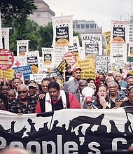 The Rev. William J. Barber II, center, leads a rally in Washington, D.C. in 2019.
