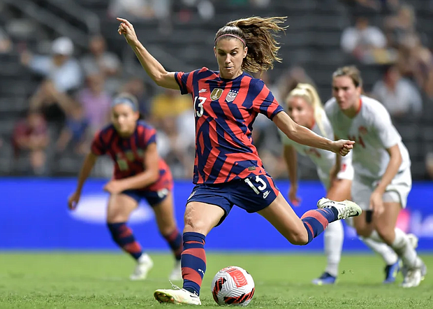 Alex Morgan kicks a penalty to score the United States' first goal during the championship match between the US and Canada on July 18, 2022, in Monterrey, Mexico. Azael Rodriguez/Getty Images