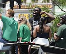 Boston Celtics NBA Finals MVP Jaylen Brown, center, celebrates during a parade on June 21.
