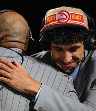 Zaccharie Risacher reacts during an interview, after being selected by the Atlanta Hawks as the first pick during the first round in the NBA basketball draft on June 26, in New York.
Mandatory Credit:	Julia Nikhinson/AP via CNN Newsource