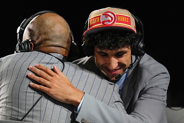 Zaccharie Risacher reacts during an interview, after being selected by the Atlanta Hawks as the first pick during the first round in the NBA basketball draft on June 26, in New York.
Mandatory Credit:	Julia Nikhinson/AP via CNN Newsource