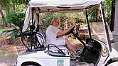 Karen Dove Barr backs out of her golf cart garage on Skidaway Island.