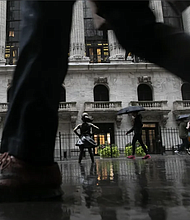 A significant share of wealthier Americans are coping with financial pressure by cutting spending, including dialing back restaurant visits and entertainment. Michael Nagle/Bloomberg/Getty Images