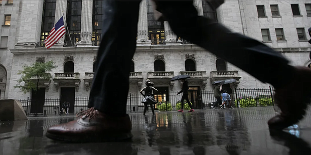 A significant share of wealthier Americans are coping with financial pressure by cutting spending, including dialing back restaurant visits and entertainment. Michael Nagle/Bloomberg/Getty Images