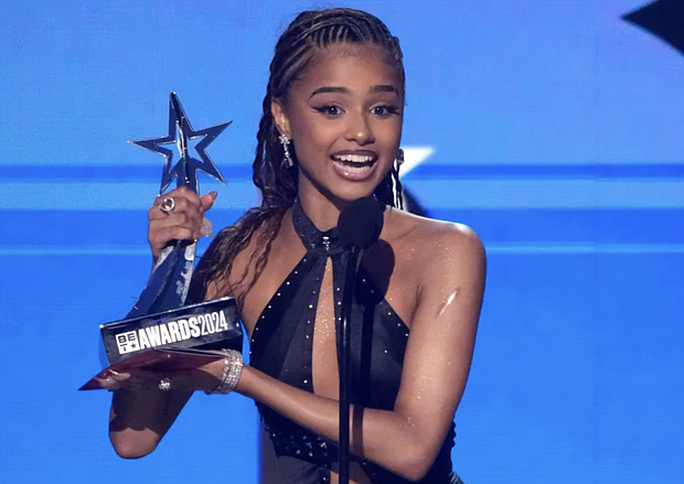 Tyla accepts accepts the award for best international act during the BET Awards on Sunday, June 30, 2024, at the Peacock Theater in Los Angeles. Chris Pizzello/Invision/AP