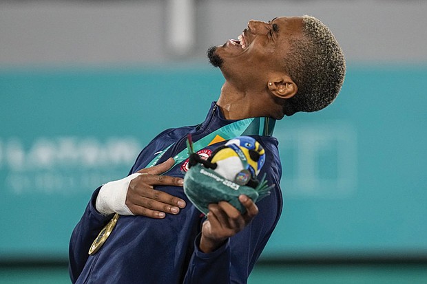 CJ Nickolas of the United States sings the national anthem after receiving a gold in men’s taekwondo at the Pan American Games in Santiago, Chile, Oct. 22, 2023. At 22, Nickolas is the highest-ranked U.S. athlete in taekwondo, No. 2 in the world in the men’s 80-kilogram (176-pound) class. A silver medalist at last year’s world championships, he will lead the four-member U.S. taekwondo team in Paris.