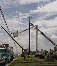Crews from out of the area help CenterPoint to restore power lines on July 11, 2024, in Houston after Hurricane Beryl. Texas Gov. Greg Abbott threatened to issue an executive order forcing electricity provider CenterPoint Energy to improve its level of storm preparedness.
Mandatory Credit:	Danielle Villasana/Getty Images via CNN Newsource