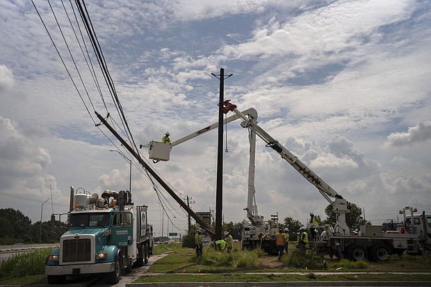 Crews from out of the area help CenterPoint to restore power lines on July 11, 2024, in Houston after Hurricane Beryl. Texas Gov. Greg Abbott threatened to issue an executive order forcing electricity provider CenterPoint Energy to improve its level of storm preparedness.
Mandatory Credit:	Danielle Villasana/Getty Images via CNN Newsource